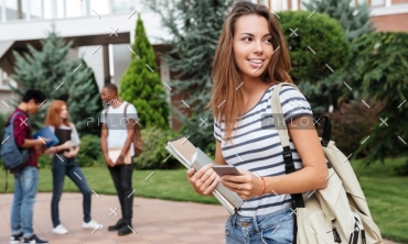 demo-attachment-1116-happy-woman-student-with-backpack-holding-books-PNFUGG71